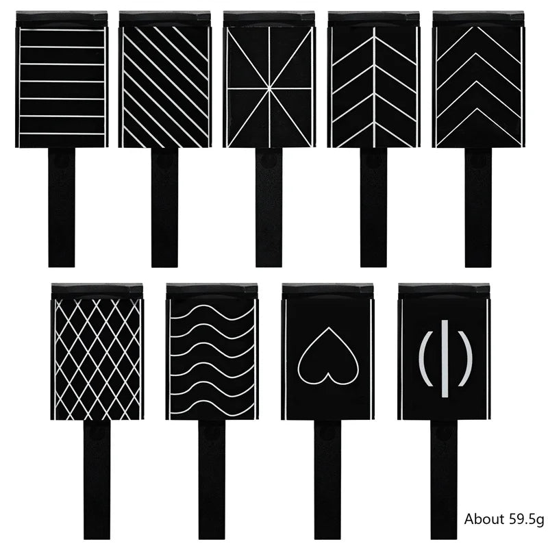 A set of five black nail magnet wands used for 3D nail art.
