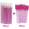 A set of 100 disposable pink eyelash and eyebrow brushes, packaged in two groups of 50.