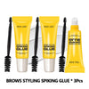 Un set de trois tubes de colle pour sourcils jaunes avec des applicateurs noirs.
