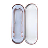 A pair of stainless steel and copper tongue scrapers for oral hygiene, presented in a silver-toned case.