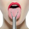 A close-up of a person's mouth showing the tongue and upper lip, with a stainless steel tongue scraper visible.