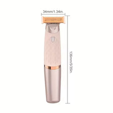 A pink portable electric hair shaver and epilator device shown vertically.