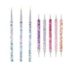 A set of precision nail art brushes with various colored bristles for gel and acrylic polish.