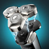 A silver electric shaver with three magnetic detachable heads is shown against a blue background.