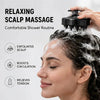 A woman is receiving a relaxing scalp massage with a black silicone tool on her hair during a shower routine.