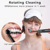 A young woman is using an electric rotary toothbrush for teeth cleaning.