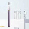 A purple sonic electric toothbrush and four replacement brush heads are displayed on a white surface.