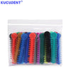 A clear plastic bag filled with colorful orthodontic elastic ligature ties for braces.