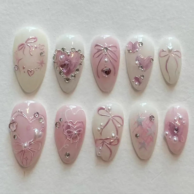 A set of 24 pink heart pearl press-on fake nails featuring delicate floral and heart designs.