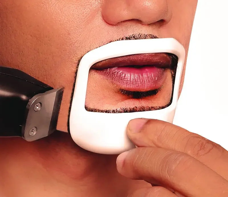 A hand holds a white shaving template against a person's upper lip and beard area.