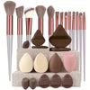 A complete makeup brush set featuring various sizes and shapes of soft synthetic bristles and sponges in shades of brown, pin