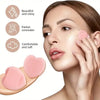 A woman applies a pink concealer to her face using a makeup brush set.