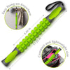 A bright lime green manual muscle roller stick is shown with a black handle and a silicone tip, demonstrating how to hang it 