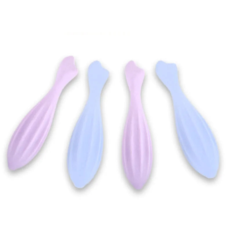Three silicone gua sha rollers in pink and light blue for facial massage and contouring