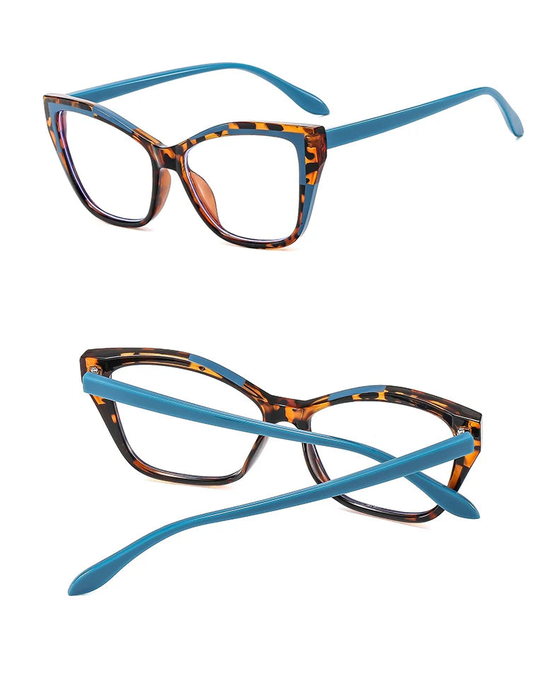 A pair of orange and black patterned cat eye reading glasses with light blue frames.
