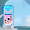 A clear electric toothbrush for kids with a pink and purple light display featuring an astronaut design.