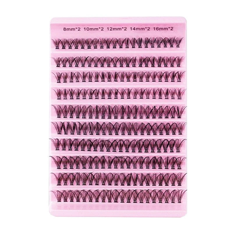 A pink plastic tray holding various sizes of C-curl eyelash extensions for a natural look.