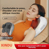 A woman is using a white shiatsu neck massager pillow on her shoulder and neck while relaxing.