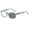 Pair of clear photochromic reading glasses with a patterned frame and anti-blue light protection.
