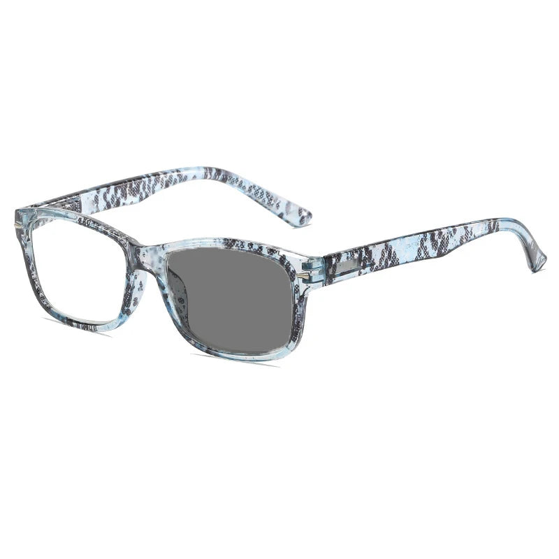 Pair of clear photochromic reading glasses with a patterned frame and anti-blue light protection.