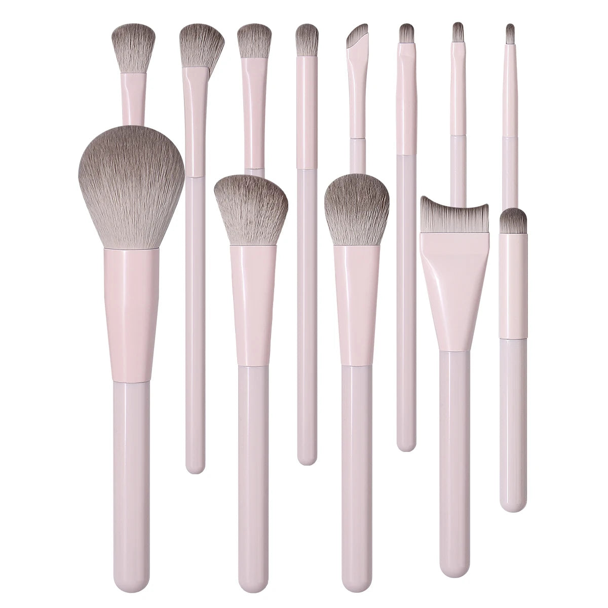 A set of thirteen professional makeup brushes in a soft pink color.