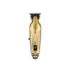 A gold-colored professional cordless hair trimmer for men with a black guard and battery indicator.