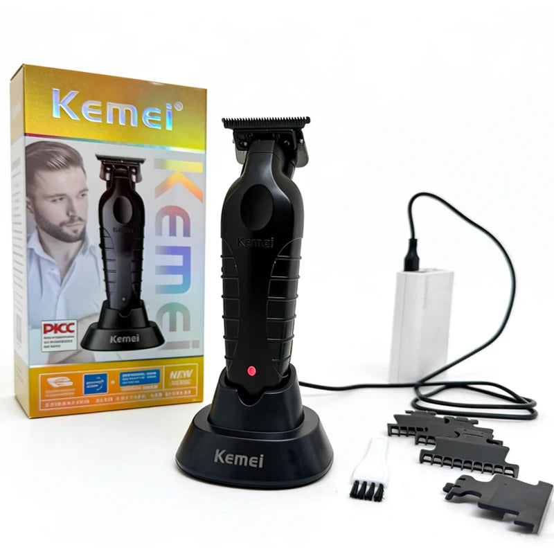 A black electric hair clipper trimmer with a charging cable and replacement attachments is shown next to its packaging.