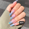A close-up of a hand displaying long, iridescent holographic chrome nails with a light pink base.