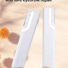 A white sonic dermaplaning tool is shown standing upright on a light surface.