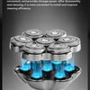 A close-up view of a silver electric shaver head with multiple magnetic suction blades and blue light accents.