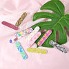 A collection of colorful double-sided nail files and buffing blocks featuring various patterns like leopard print, floral des