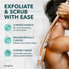 A person is using a wooden exfoliating brush with a long handle on their shoulder during a body scrub.