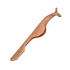 A close-up view of a rose gold stainless steel eyelash tweezers tool.