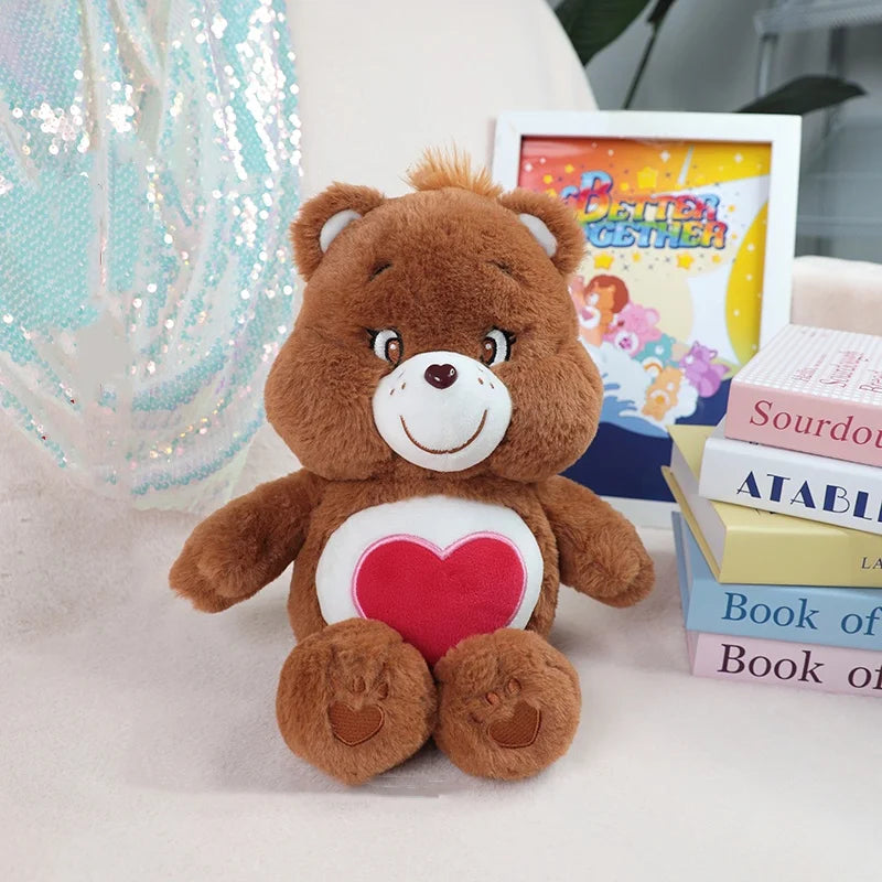 A brown classic care bears plush stuffed animal doll with a red heart on its chest sits next to a framed book.