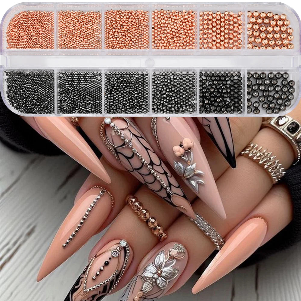A collection of gold mixed stainless steel bead nail art decorations displayed on a hand with long, pointed nails.