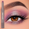 A cosmetic product showing a mauve eyeshadow stick with a brush on an eye.