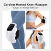 A white cordless heated knee massager device shown being used on a person's leg.