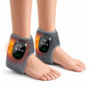 A person's ankle is shown wearing a gray massager with orange heat lines, demonstrating the portable heated vibration ankle m