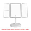 A white foldable LED makeup mirror with a round base and three mirrored panels.