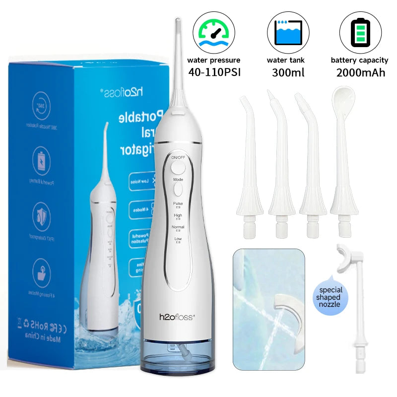 A white portable water flosser oral irrigator device shown with accessories and packaging.
