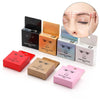 Various colored boxes and a close-up of an eyebrow mapping thread for microblading