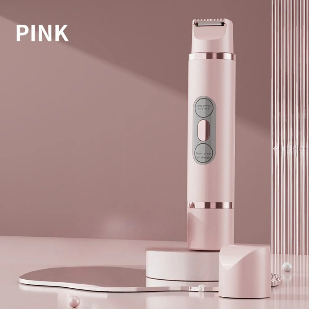 A pink portable electric body hair trimmer standing on a glass surface.