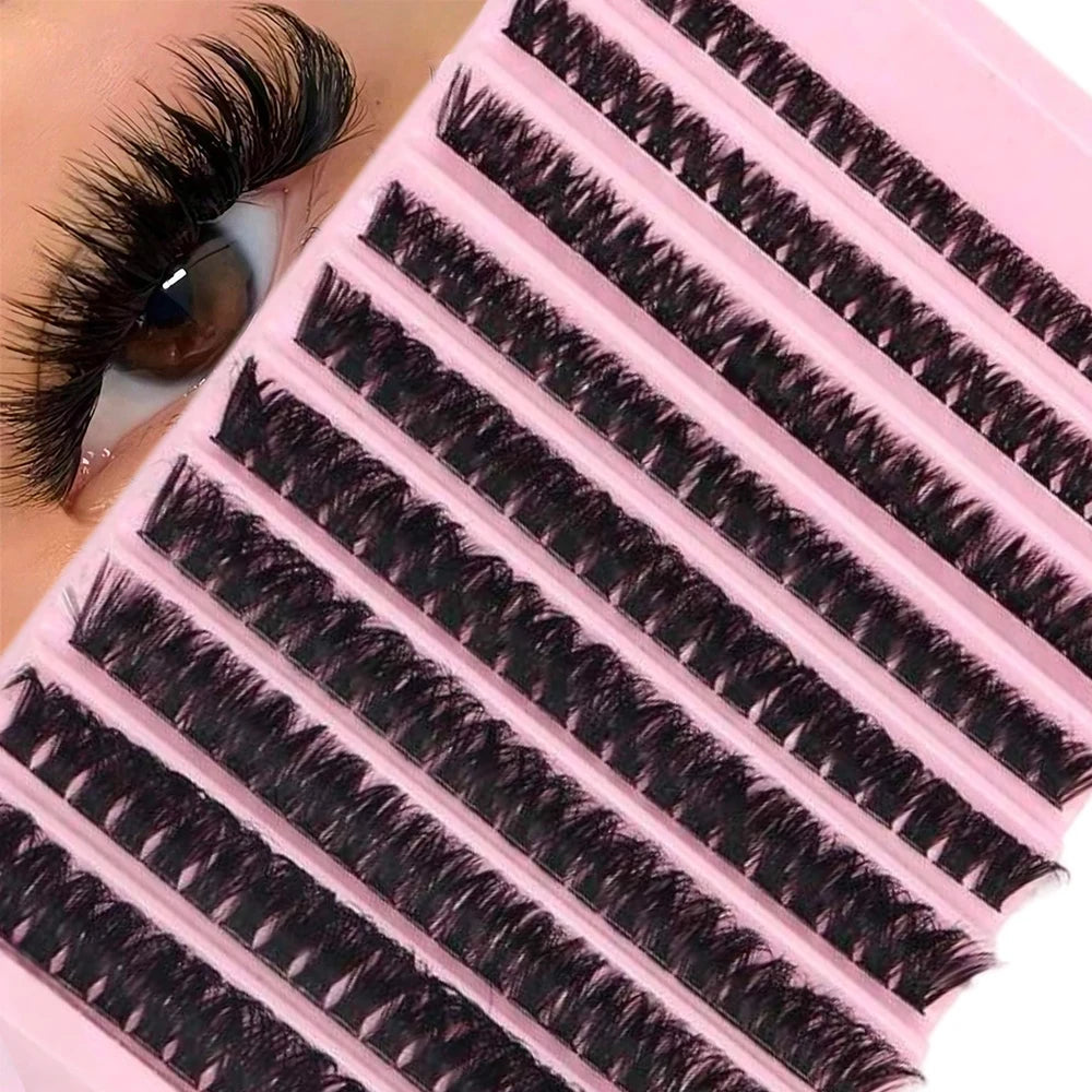 A pink plastic container filled with black cluster eyelashes for DIY beauty