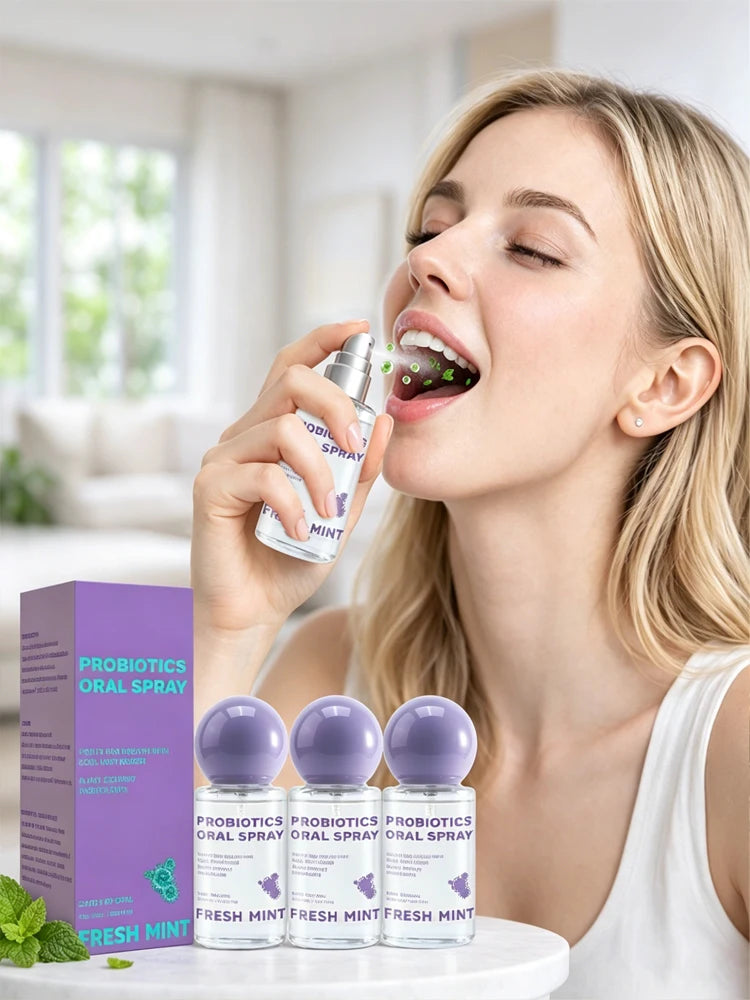 A woman sprays a probiotic oral spray for breath freshening in a bright indoor setting.