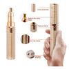 A gold-colored 3-in-1 facial and body hair removal device shown with various components and a hand.