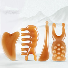 A set of five amber-colored silicone facial massage and lifting tools for skin treatment.
