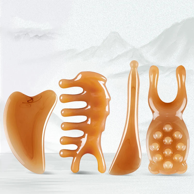 A set of five amber-colored silicone facial massage and lifting tools for skin treatment.