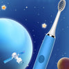 A blue electric toothbrush is shown against a dark blue night sky with stars and a large blue planet, featuring an elephant c