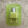 A precision electric beard trimmer in a light green plastic case resting on a speckled countertop.