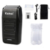A black electric hair clipper kit showing the main unit, a blade, and disposable hair guards.